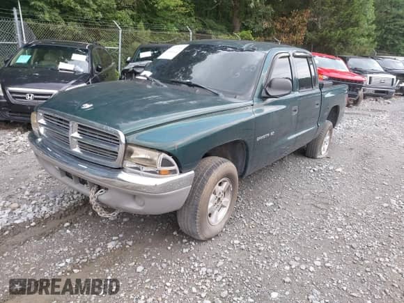 2001 Dodge Dakota with VIN 1B7GG2AX31S205013, listed as a IAAI auction lot 42509114 with 239,125 mi miles and . Bid and sale history available at DreamBid. Image 2.