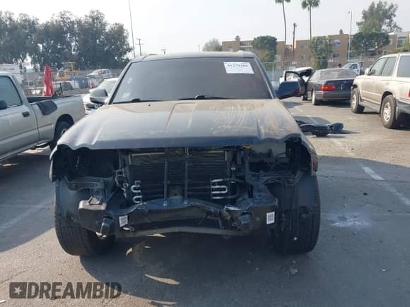 2009 Jeep Grand Cherokee with VIN 1J8HR78W49C550879, listed as a IAAI auction lot 41279386 with 126,314 mi miles and . Bid and sale history available at DreamBid. Image 13.