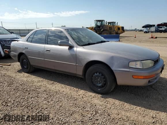 1994 Toyota Camry LE z VIN JT2SK12E7R0253579, wystawiony jako Copart lot #64373175 z przebiegiem 256 168 mil mil oraz Szkoda całkowita • Salvage title. Historia ofert i sprzedaży dostępna na DreamBid. Obrazek 4.