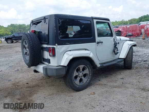 2016 Jeep Wrangler Sahara with VIN 1C4AJWBG8GL111158, listed as a IAAI auction lot 42602359 with Not provided miles and . Bid and sale history available at DreamBid. Image 4.