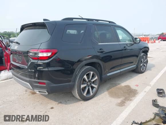 2023 Honda Pilot Elite with VIN 5FNYG1H81PB050321, listed as a IAAI auction lot 42346325 with 13,201 mi miles and . Bid and sale history available at DreamBid. Image 4.