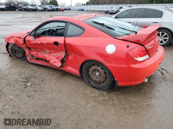 2005 Hyundai Tiburon SE с VIN KMHHN65D75U159404, выставлен на аукционе Copart как лот 83964364 с пробегом 151 777 миль миль и Списание • Salvage title. История ставок и продаж доступна на DreamBid. Изображение 2.