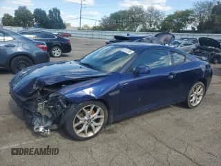 2007 Hyundai Tiburon GT с VIN KMHHN66F97U256039, выставлен на аукционе Copart как лот 82313705 с пробегом 151 935 миль миль и Списание • Salvage title. История ставок и продаж доступна на DreamBid. Изображение 1.