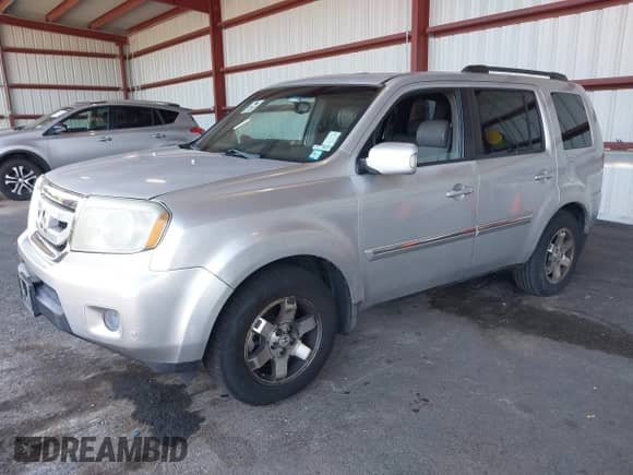 2009 Honda Pilot Touring with VIN 5FNYF48929B004092, listed as a IAAI auction lot 43116551 with 232,447 mi miles and . Bid and sale history available at DreamBid. Image 2.