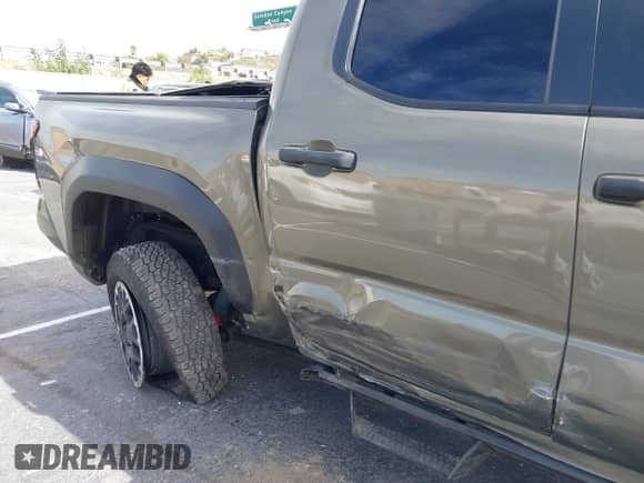 2024 Toyota Tacoma SR5 with VIN 3TMLB5JN6RM027745, listed as a IAAI auction lot 41479793 with 16,376 mi miles and . Bid and sale history available at DreamBid. Image 6.