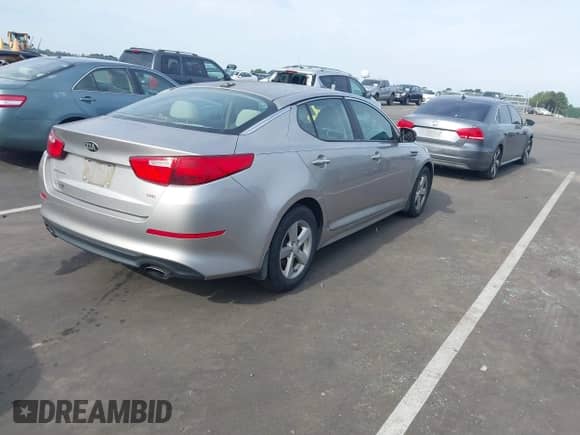 2015 Kia Optima LX with VIN 5XXGM4A70FG395889, listed as a IAAI auction lot 43102681 with 136,311 mi miles and . Bid and sale history available at DreamBid. Image 4.