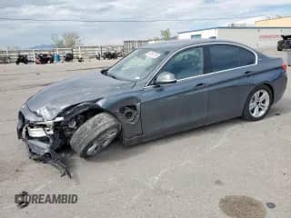 2018 BMW 3 Series 330e with VIN WBA8E1C59JA178130, listed as a Copart auction lot 66560795 with 69,795 mi miles and Salvage title. Bid and sale history available at DreamBid. Image 1.