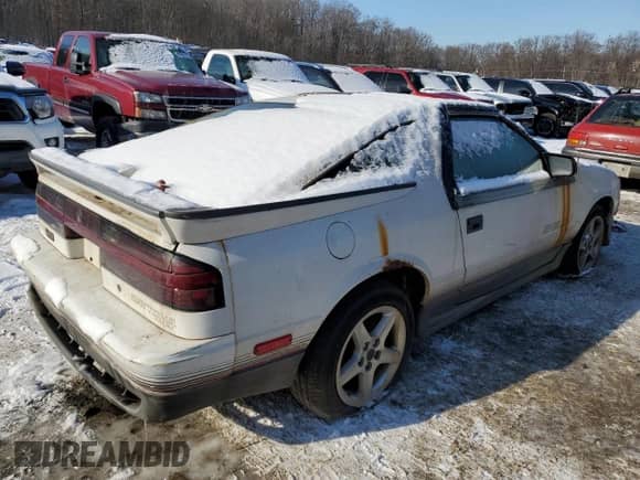 1989 Dodge Daytona with VIN 1B3XG74A5KG113363, listed as a Copart auction lot 88239065 with 209,485 mi miles and Salvage title. Bid and sale history available at DreamBid. Image 3.