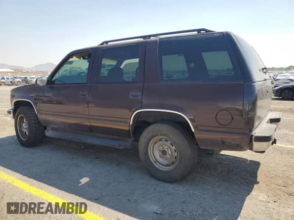 1997 Chevrolet Tahoe with VIN 1GNEK13R4VJ364091, listed as a Copart auction lot 68326715 with 153,429 mi miles and Salvage title. Bid and sale history available at DreamBid. Image 2.