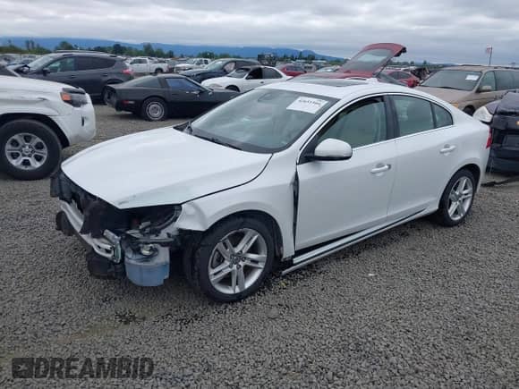2015 Volvo S60 T5 Drive-E Premier with VIN YV140MFK2F2339819, listed as a IAAI auction lot 42651504 with 127,550 mi miles and . Bid and sale history available at DreamBid. Image 2.