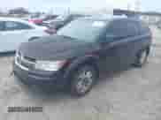 2013 Dodge Journey American Value z VIN 3C4PDCAB1DT695392, wystawiony jako IAAI lot #43098134 z przebiegiem 209 536 mil mil oraz . Historia ofert i sprzedaży dostępna na DreamBid. Obrazek 2.