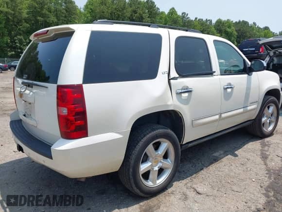 2008 Chevrolet Tahoe LTZ with VIN 1GNFC13J38R248270, listed as a IAAI auction lot 42403526 with 216,031 mi miles and . Bid and sale history available at DreamBid. Image 4.