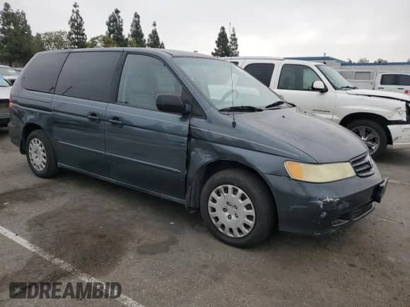 2004 Honda Odyssey LX with VIN 5FNRL18574B137609, listed as a Copart auction lot 68292805 with 172,873 mi miles and Salvage title. Bid and sale history available at DreamBid. Image 4.