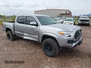 2016 Toyota Tacoma TRD Sport z VIN 3TMCZ5AN8GM009062, wystawiony jako IAAI lot #43262475 z przebiegiem 102 097 mil mil oraz . Historia ofert i sprzedaży dostępna na DreamBid. Obrazek 1.