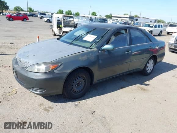 2004 Toyota Camry LE with VIN JTDBE32K940285801, listed as a IAAI auction lot 42335640 with 109,719 mi miles and . Bid and sale history available at DreamBid. Image 2.