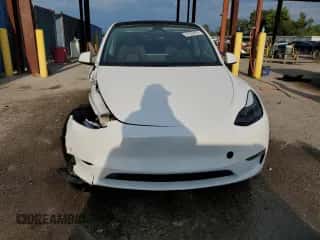 2023 Tesla Model Y Long Range with VIN 7SAYGAEE4PF863973, listed as a Copart auction lot 67838404 with 25,165 mi miles and Salvage title. Bid and sale history available at DreamBid. Image 5.