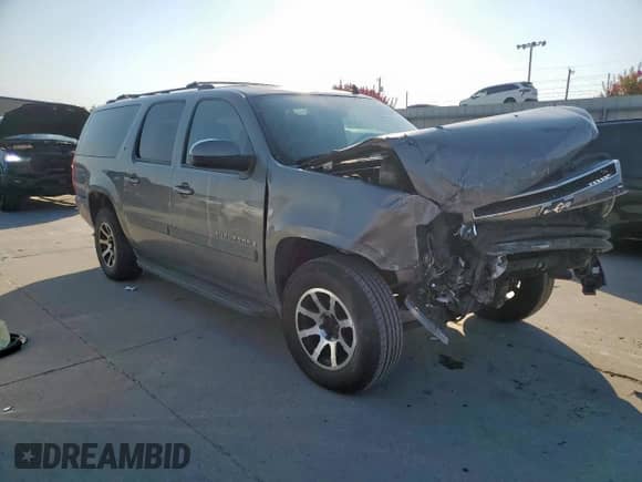2007 Chevrolet Suburban LT с VIN 1GNFC16017J406329, выставлен на аукционе Copart как лот 81088985 с пробегом Не указан миль и Списание • Salvage title. История ставок и продаж доступна на DreamBid. Изображение 4.