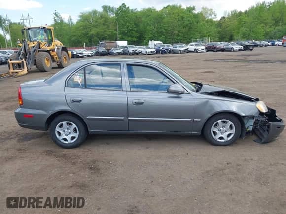 2004 Hyundai Accent GL z VIN KMHCG45C84U514658, wystawiony jako IAAI lot #42222115 z przebiegiem 33 055 mil mil oraz . Historia ofert i sprzedaży dostępna na DreamBid. Obrazek 13.