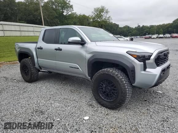2024 Toyota Tacoma SR5 with VIN 3TYLB5JN8RT060119, listed as a Copart auction lot 83873505 with 25 mi miles and Salvage title. Bid and sale history available at DreamBid. Image 4.