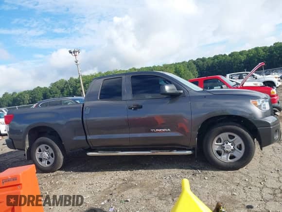 2012 Toyota Tundra z VIN 5TFRU5F14CX026640, wystawiony jako IAAI lot #42994627 z przebiegiem 310 619 mil mil oraz . Historia ofert i sprzedaży dostępna na DreamBid. Obrazek 13.