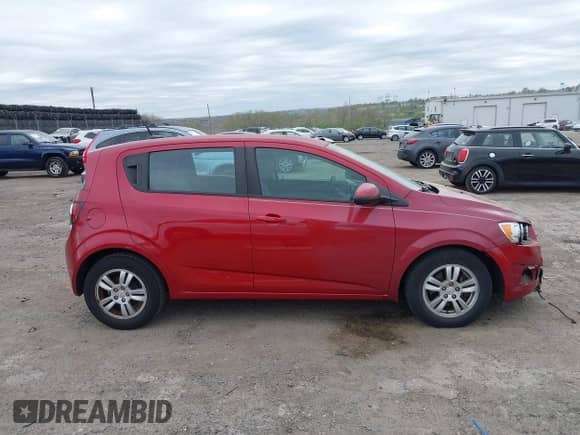 2012 Chevrolet Sonic LS with VIN 1G1JB6SHXC4114498, listed as a IAAI auction lot 42091500 with 128,638 mi miles and . Bid and sale history available at DreamBid. Image 14.