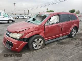 2009 Dodge Journey SXT with VIN 3D4GG57V89T215203, listed as a Copart auction lot 71056615 with 223,065 mi miles and Salvage title. Bid and sale history available at DreamBid. Image 1.