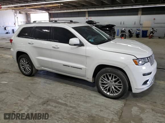 2018 Jeep Grand Cherokee Summit with VIN 1C4RJFJT5JC273869, listed as a Copart auction lot 57482865 with 70,843 mi miles and Salvage title. Bid and sale history available at DreamBid. Image 4.