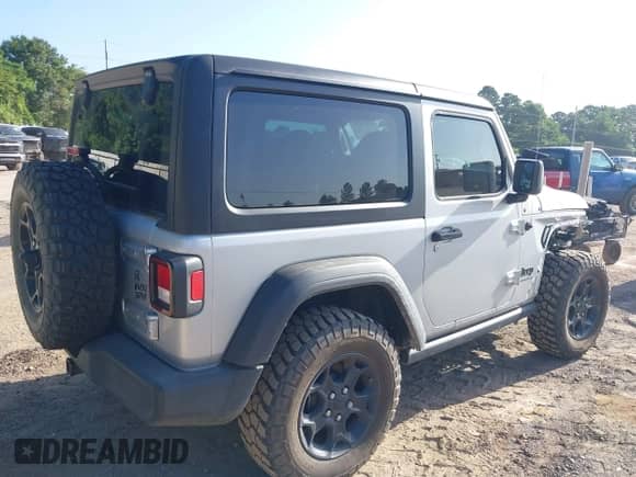 2023 Jeep Wrangler Sport with VIN 1C4HJXAGXPW674068, listed as a IAAI auction lot 42543846 with 15,722 mi miles and . Bid and sale history available at DreamBid. Image 4.