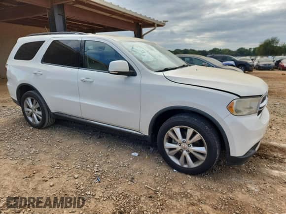 2012 Dodge Durango Crew with VIN 1C4RDHDG3CC257898, listed as a Copart auction lot 82149875 with 191,702 mi miles and Salvage title. Bid and sale history available at DreamBid. Image 4.