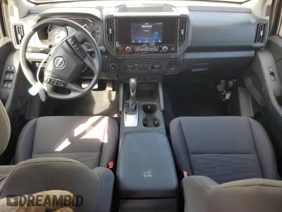 2025 Nissan Frontier Pro-4X with VIN 1N6ED1EK2SN628803, listed as a Copart auction lot 65702835 with 1,574 mi miles and Salvage title. Bid and sale history available at DreamBid. Image 8.