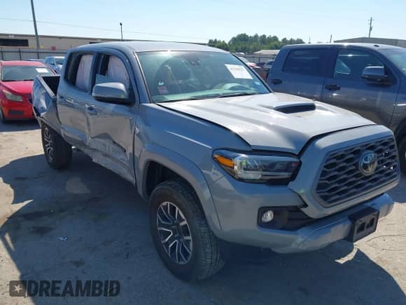 2021 Toyota Tacoma SR5 z VIN 5TFAZ5CN4MX097831, wystawiony jako IAAI lot #43320227 z przebiegiem 31 588 mil mil oraz . Historia ofert i sprzedaży dostępna na DreamBid. Obrazek 1.