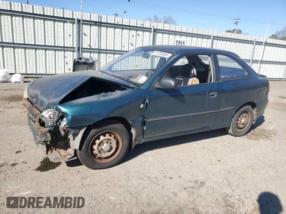 1999 Hyundai Accent L z VIN KMHVD14N4XU456698, wystawiony jako Copart lot #41733345 z przebiegiem 197 574 mil mil oraz Szkoda całkowita • Salvage title. Historia ofert i sprzedaży dostępna na DreamBid. Obrazek 1.