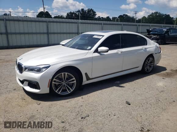 2019 BMW 7 Series 750i with VIN WBA7F0C55KGM24513, listed as a Copart auction lot 61728595 with 26,303 mi miles and Salvage title. Bid and sale history available at DreamBid. Image 1.