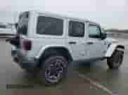 2023 Jeep Wrangler Rubicon z VIN 1C4JJXFM4PW589923, wystawiony jako Copart lot #58725465 z przebiegiem 9 814 mil mil oraz Szkoda całkowita • Salvage title. Historia ofert i sprzedaży dostępna na DreamBid. Obrazek 3.