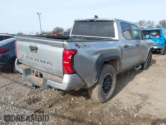 2024 Toyota Tacoma SR5 with VIN 3TYLB5JN0RT037837, listed as a IAAI auction lot 41315485 with 14,471 mi miles and . Bid and sale history available at DreamBid. Image 4.