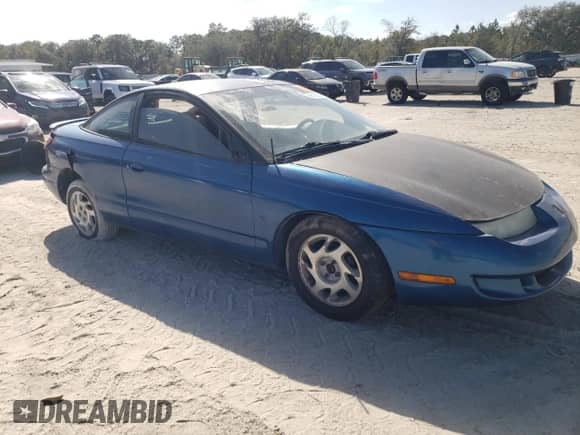 2000 Saturn SC с VIN 1G8ZP1285YZ140090, выставлен на аукционе Copart как лот 61026775 с пробегом Не указан миль и На запчасти • Non repairable. История ставок и продаж доступна на DreamBid. Изображение 4.