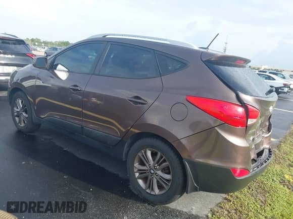 2014 Hyundai Tucson Limited with VIN KM8JU3AGXEU833578, listed as a IAAI auction lot 42646016 with 122,387 mi miles and . Bid and sale history available at DreamBid. Image 3.