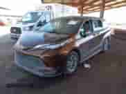 2021 Toyota Sienna LE with VIN 5TDKRKEC5MS042826, listed as a IAAI auction lot 43351756 with 71,662 mi miles and . Bid and sale history available at DreamBid. Image 2.