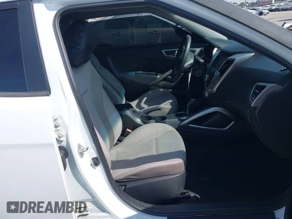 2014 Hyundai Veloster with VIN KMHTC6AD8EU209409, listed as a IAAI auction lot 42087236 with 124,459 mi miles and . Bid and sale history available at DreamBid. Image 5.