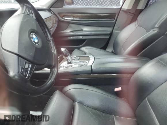 2011 BMW 7 Series 750i xDrive with VIN WBAKC6C55BC394717, listed as a Copart auction lot 59570605 with Not provided miles and Salvage title. Bid and sale history available at DreamBid. Image 7.