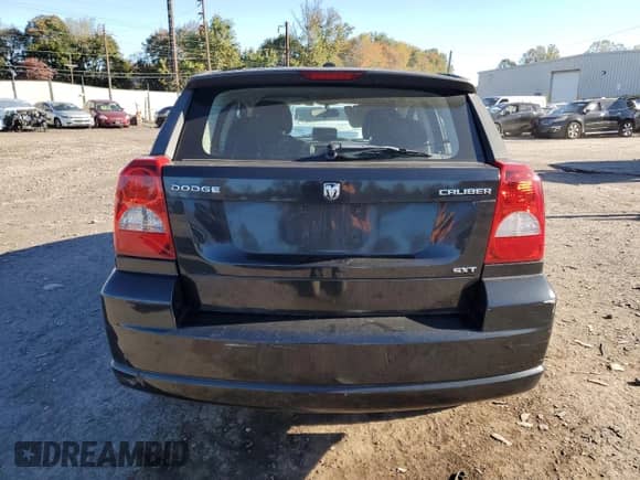 2010 Dodge Caliber SXT with VIN 1B3CB4HA9AD635046, listed as a Copart auction lot 82397075 with 190,652 mi miles and Salvage title. Bid and sale history available at DreamBid. Image 6.
