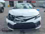 2021 Toyota Camry LE with VIN 4T1C11AK8MU601313, listed as a IAAI auction lot 43383218 with 34,384 mi miles and . Bid and sale history available at DreamBid. Image 6.