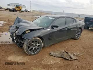 2021 Dodge Charger SXT с VIN 2C3CDXBGXMH608537, выставлен на аукционе Copart как лот 82309655 с пробегом Не указан миль и Списание • Salvage title. История ставок и продаж доступна на DreamBid. Изображение 1.