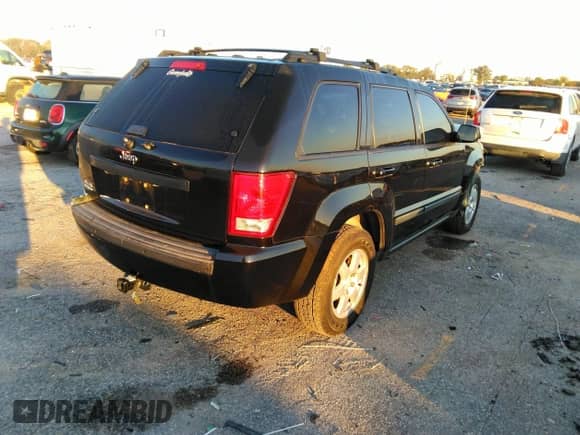 2009 Jeep Grand Cherokee Laredo with VIN 1J8GR48K49C530283, listed as a IAAI auction lot 42864990 with 106,572 mi miles and . Bid and sale history available at DreamBid. Image 4.