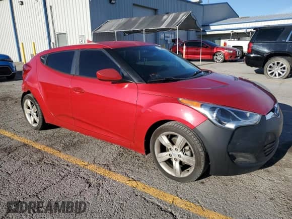 2013 Hyundai Veloster w/Black Int с VIN KMHTC6AD0DU166697, выставлен на аукционе Copart как лот 71646805 с пробегом 158 640 миль миль и Списание • Salvage title. История ставок и продаж доступна на DreamBid. Изображение 4.