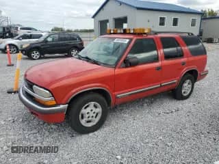 1999 Chevrolet Blazer LS z VIN 1GNDT13W5X2227396, wystawiony jako Copart lot #86856605 z przebiegiem 122 280 mil mil oraz Czysty tytuł • Clean title. Historia ofert i sprzedaży dostępna na DreamBid. Obrazek 1.