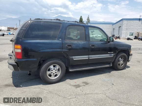 2002 Chevrolet Tahoe LS with VIN 1GNEC13T52R290024, listed as a Copart auction lot 65583635 with 154,333 mi miles and Salvage title. Bid and sale history available at DreamBid. Image 3.