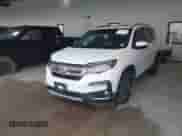 2020 Honda Pilot Touring 7-Passenger z VIN 5FNYF5H60LB026398, wystawiony jako IAAI lot #41294517 z przebiegiem 52 917 mil mil oraz . Historia ofert i sprzedaży dostępna na DreamBid. Obrazek 2.