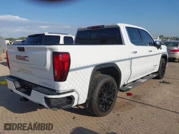 2023 GMC Sierra 1500 Denali z VIN 3GTUUGED4PG345211, wystawiony jako IAAI lot #42995625 z przebiegiem 63 396 mil mil oraz . Historia ofert i sprzedaży dostępna na DreamBid. Obrazek 4.