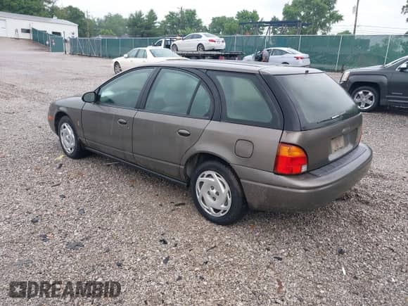 2000 Saturn SW with VIN 1G8ZJ8274YZ132063, listed as a IAAI auction lot 42453187 with 140,166 mi miles and . Bid and sale history available at DreamBid. Image 3.